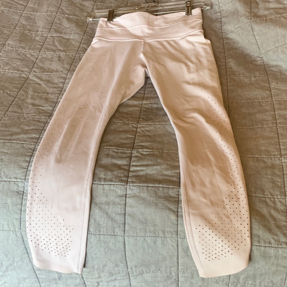 Athleta white 7/8 leggings with detail.